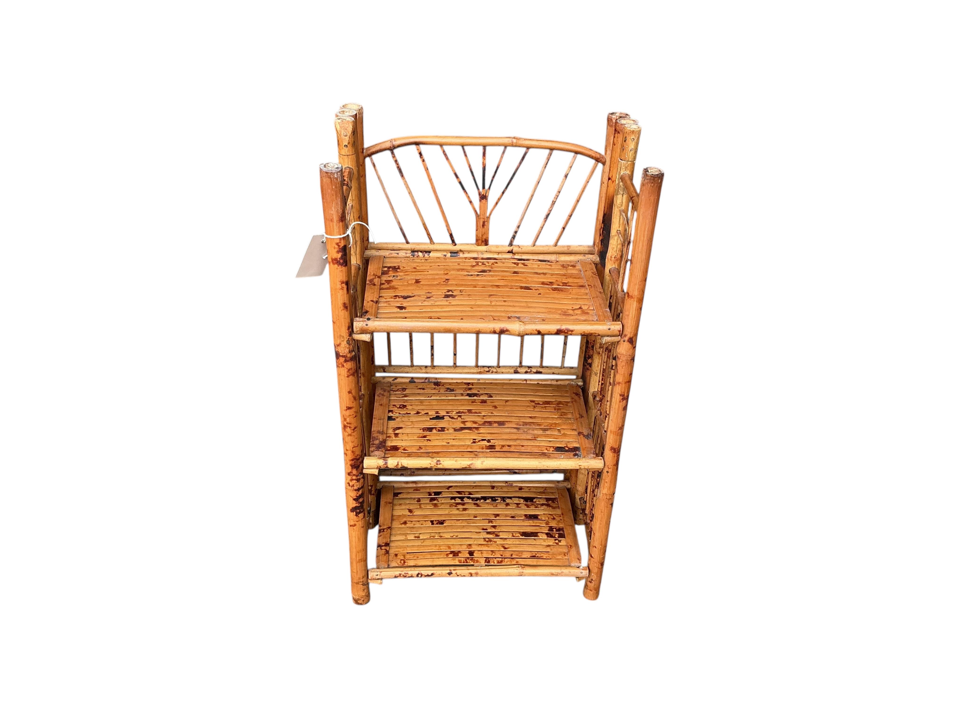 A folding bamboo open shelf unit, width 36cm, depth 23cm, height 66cm